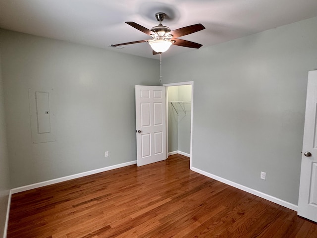 unfurnished room featuring ceiling fan and hardwood / wood-style floors