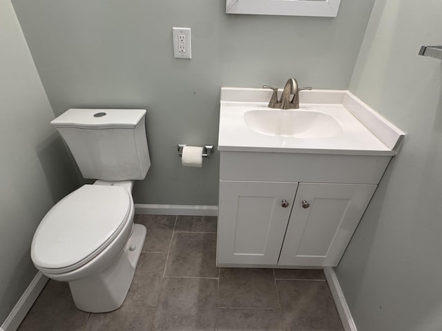 bathroom featuring tile patterned floors, vanity, and toilet