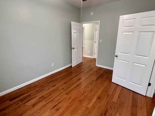 unfurnished bedroom featuring hardwood / wood-style flooring