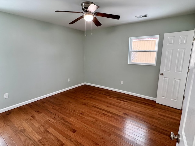 empty room with wood-type flooring and ceiling fan