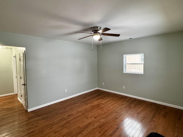 spare room with ceiling fan and wood-type flooring