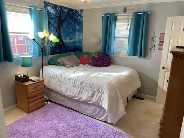 carpeted bedroom featuring ornamental molding