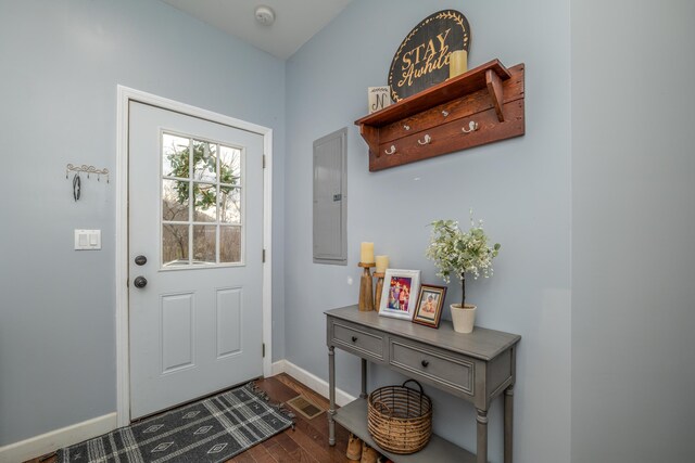 bathroom with tiled tub, crown molding, wood-type flooring, and toilet