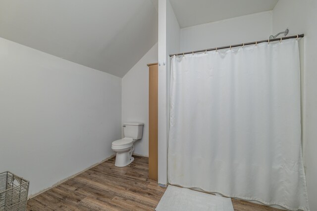 washroom with washing machine and dryer and dark hardwood / wood-style flooring