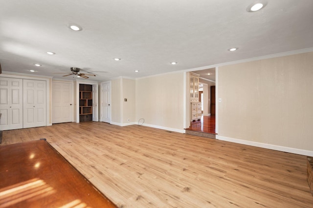 unfurnished living room with light wood-type flooring, ceiling fan, and crown molding