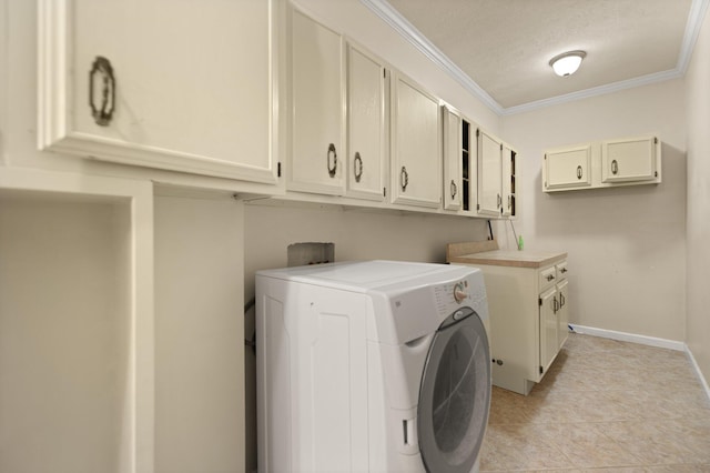 clothes washing area with cabinets, crown molding, washer / dryer, and a textured ceiling