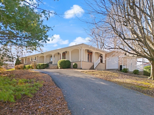 single story home featuring a garage