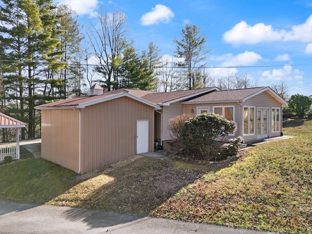 view of home's exterior with a lawn