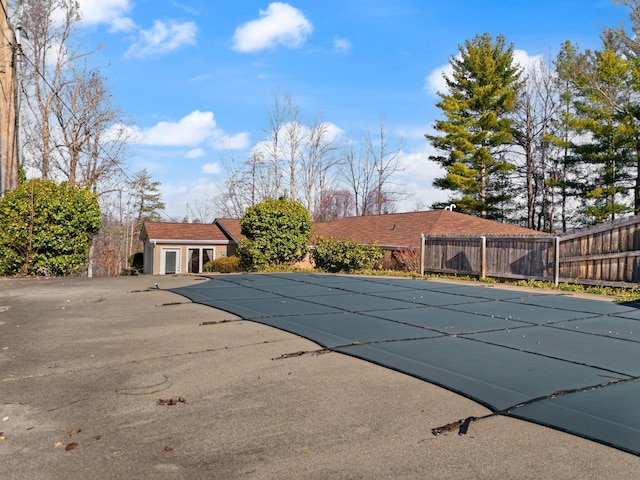 view of swimming pool with a patio area and an outdoor structure