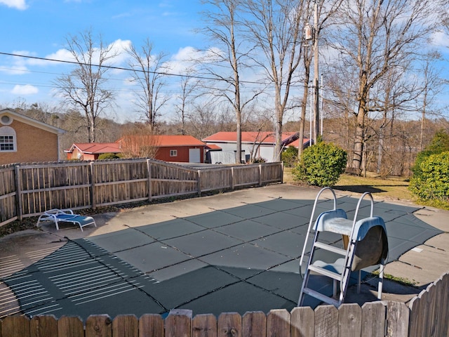 view of swimming pool with a patio