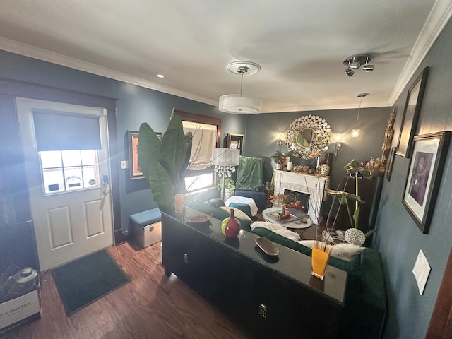 bedroom featuring a high end fireplace, dark hardwood / wood-style flooring, and ornamental molding