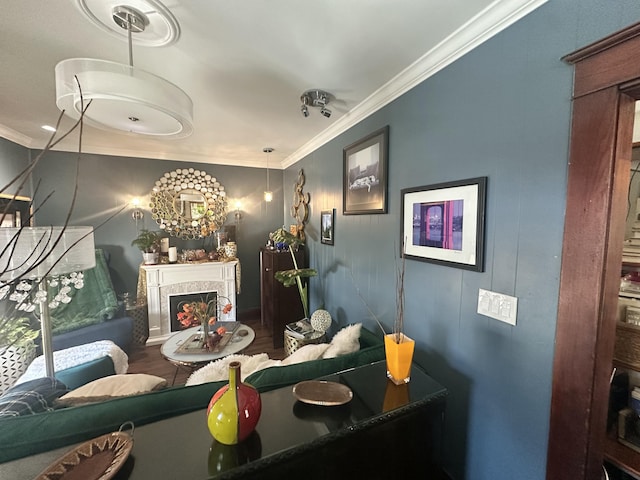 bathroom featuring a fireplace and crown molding