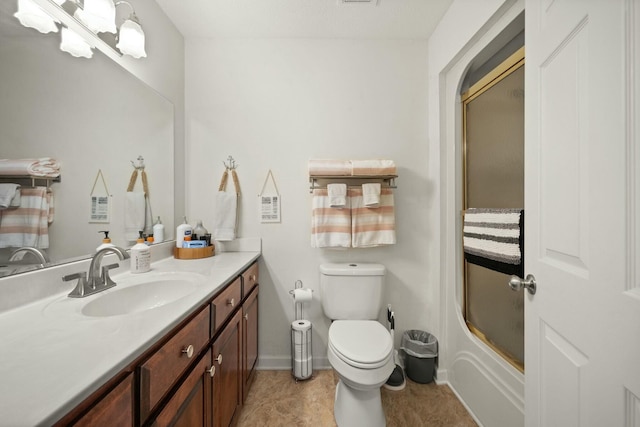 full bathroom with vanity, toilet, and combined bath / shower with glass door