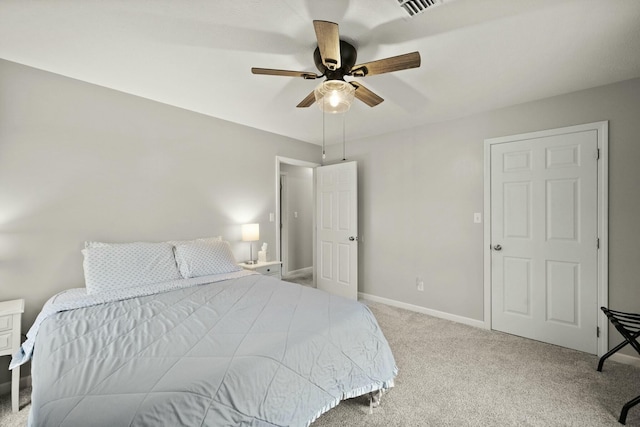 bedroom featuring light carpet and ceiling fan