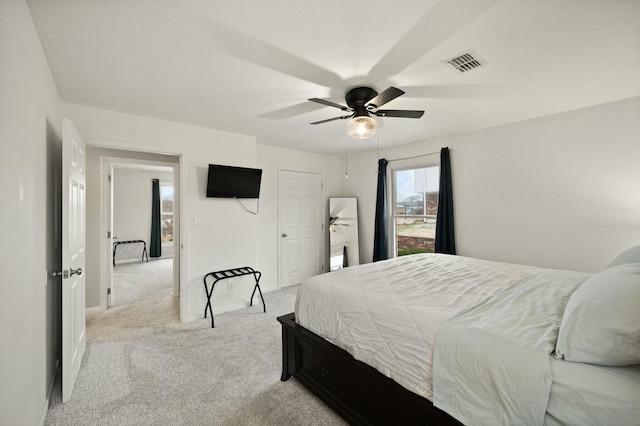 carpeted bedroom with ceiling fan