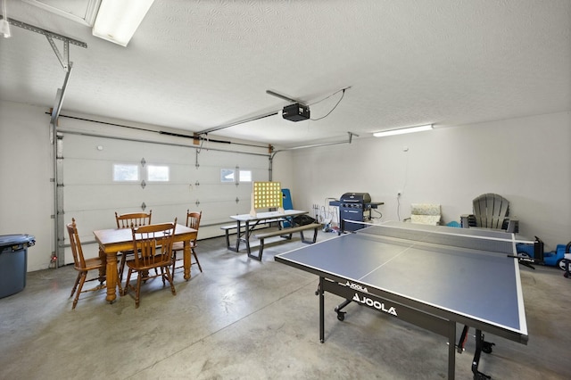 rec room with concrete floors and a textured ceiling