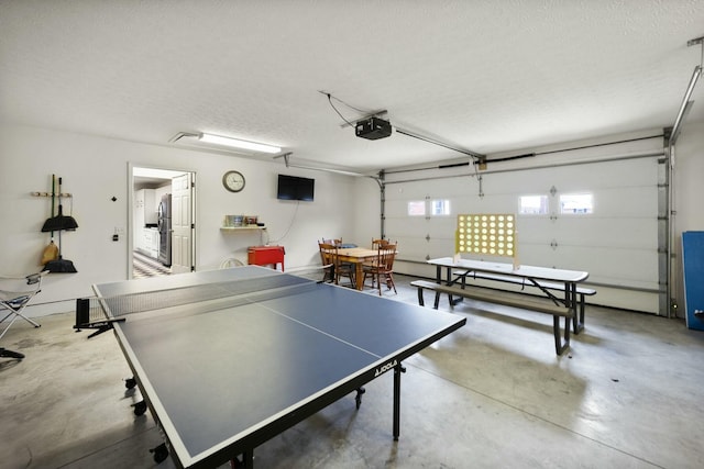 game room with concrete floors and a textured ceiling