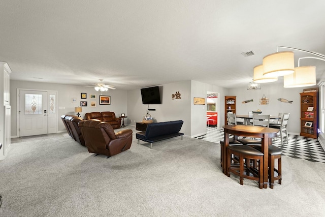 living room with carpet floors and ceiling fan