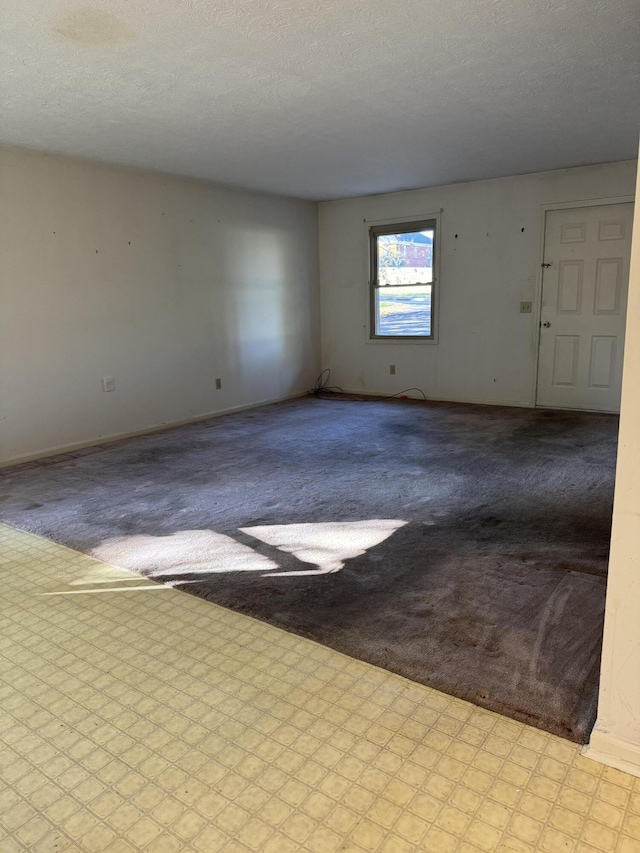 spare room featuring a textured ceiling