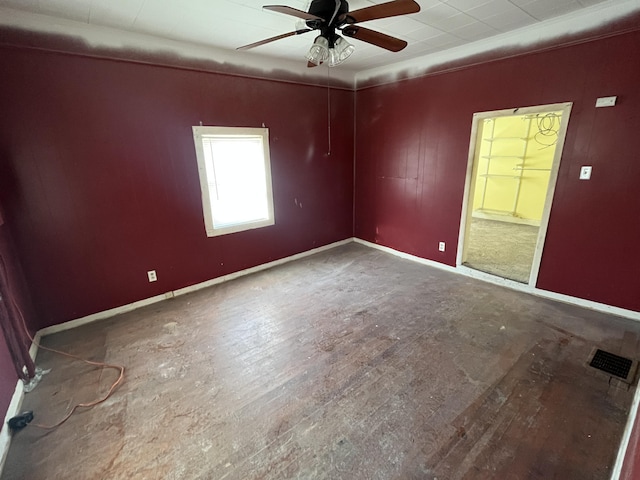 spare room with wood-type flooring and ceiling fan