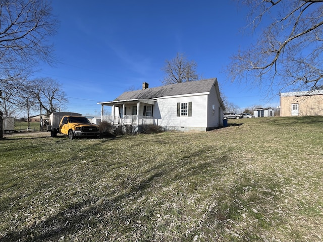 exterior space with a porch and a lawn