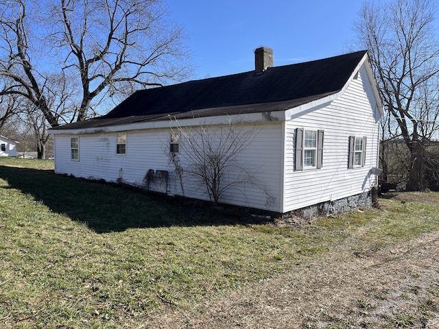 view of property exterior with a yard