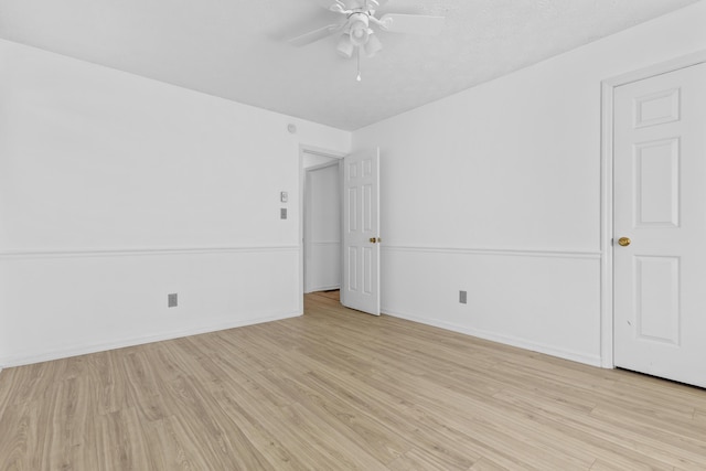 unfurnished room with ceiling fan and light hardwood / wood-style floors