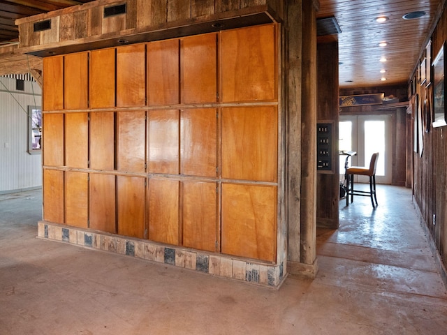 interior space featuring wood walls