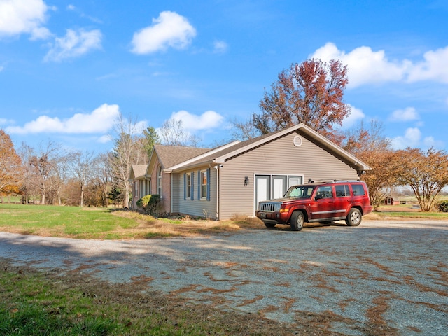 view of property exterior featuring a yard