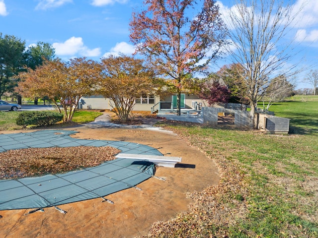 view of yard with a patio area and a covered pool