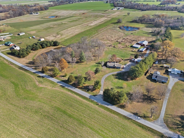 drone / aerial view with a water view and a rural view