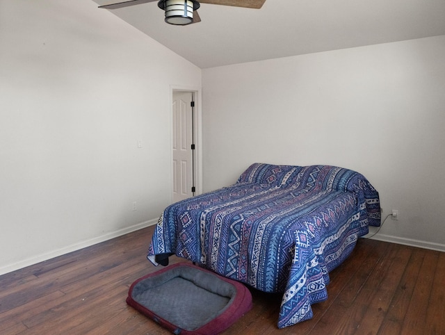 bedroom with ceiling fan, dark hardwood / wood-style floors, and lofted ceiling