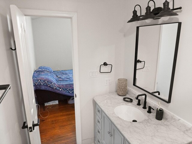 bathroom with hardwood / wood-style flooring and vanity