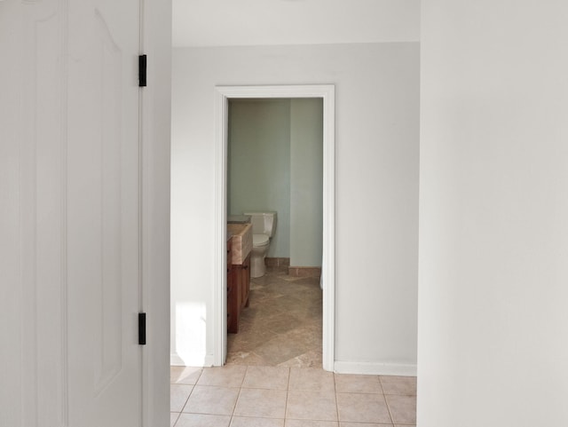 hallway featuring light tile patterned floors