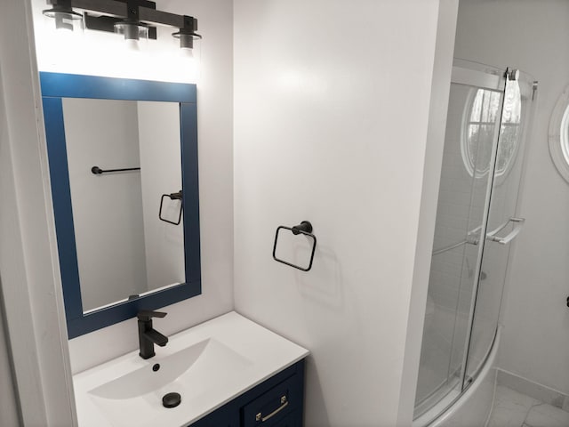 bathroom with an enclosed shower and vanity