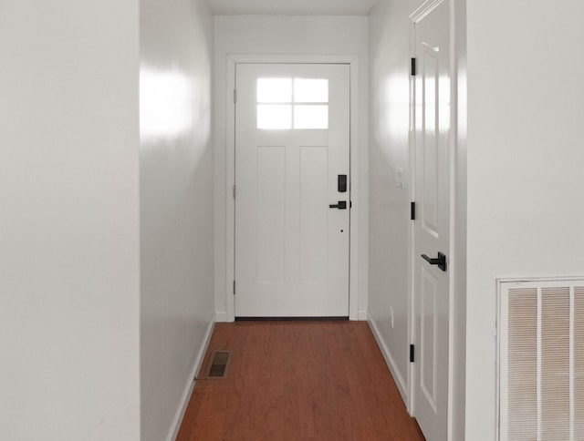 doorway to outside with dark wood-type flooring