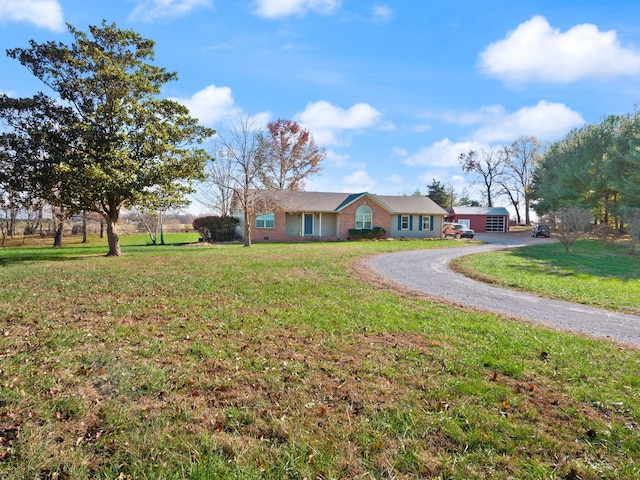 ranch-style home with a front yard