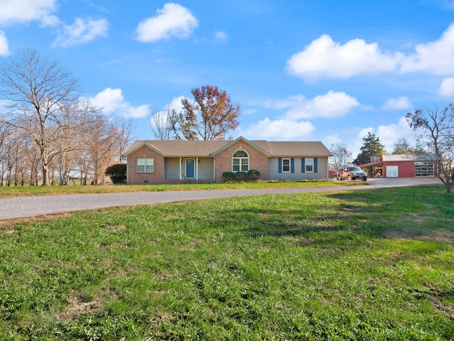 ranch-style house featuring a front yard