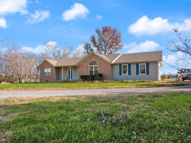 single story home featuring a front yard