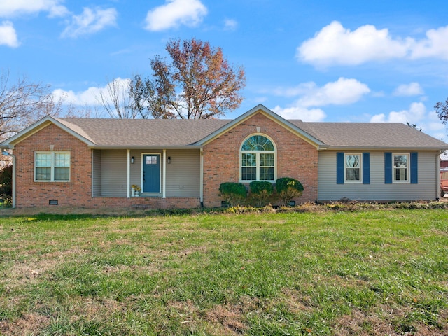 ranch-style house featuring a front lawn