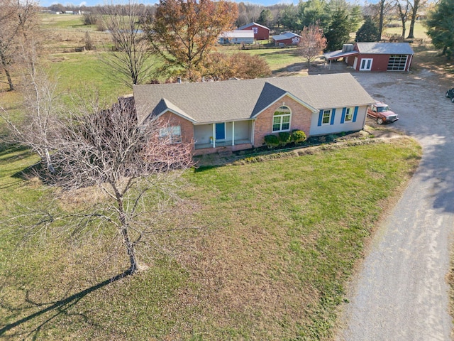 view of front of house with a front lawn and an outdoor structure