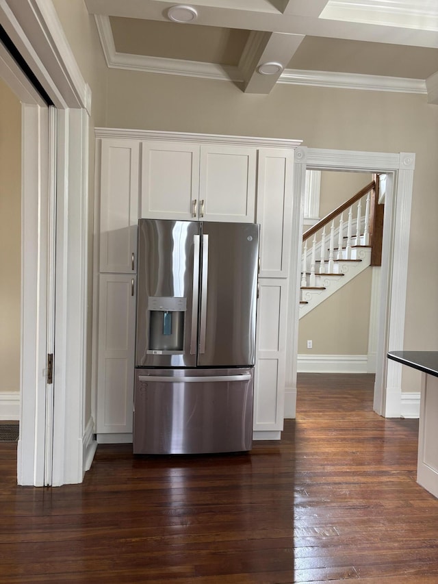 kitchen featuring white cabinetry, dark hardwood / wood-style flooring, beamed ceiling, and stainless steel refrigerator with ice dispenser