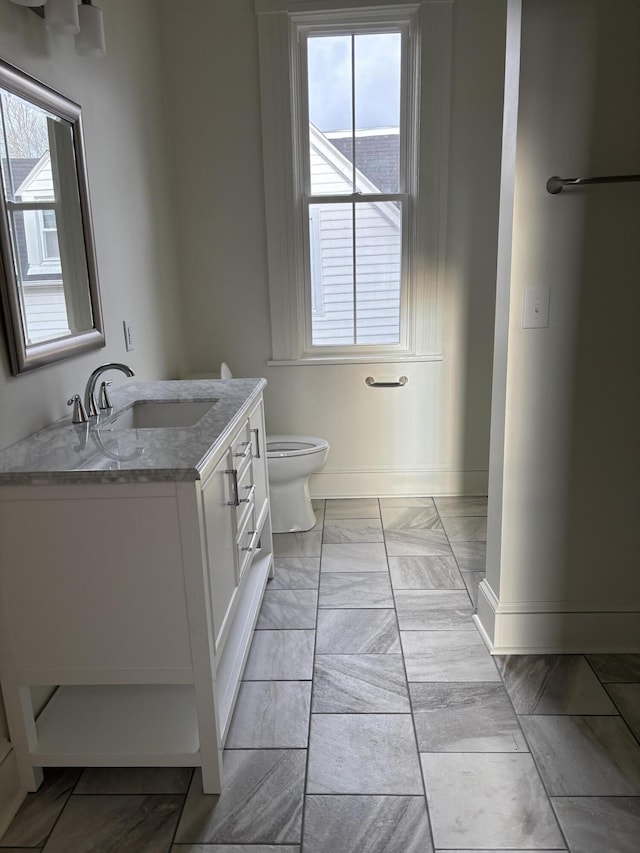 bathroom with vanity and toilet