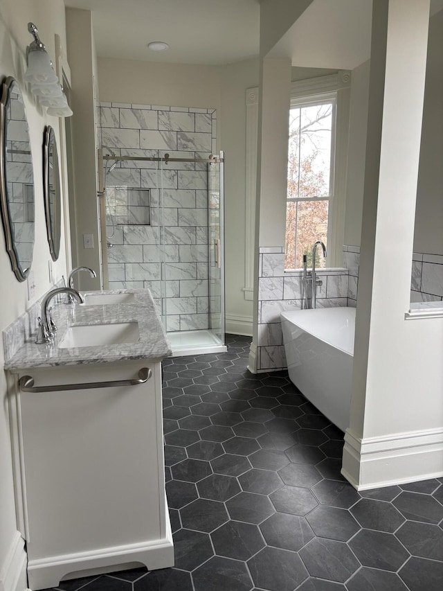 bathroom featuring separate shower and tub, tile patterned flooring, and vanity