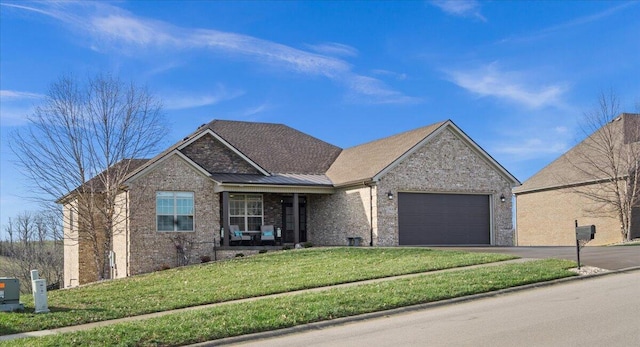 view of front facade featuring a garage and a front lawn