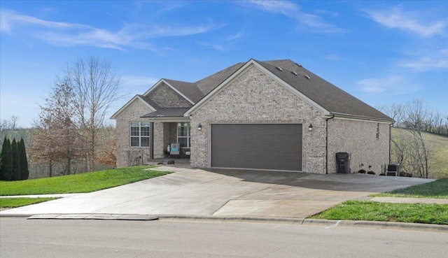 view of front of house featuring a garage and cooling unit