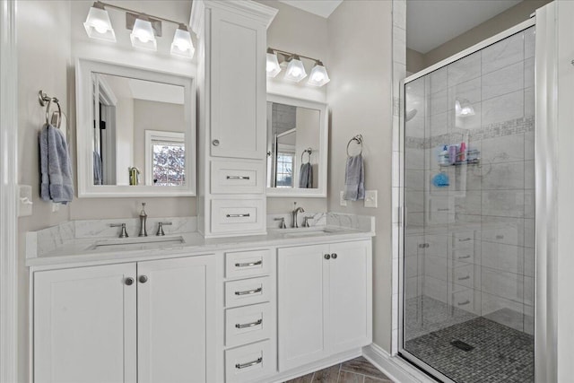 bathroom featuring vanity and an enclosed shower