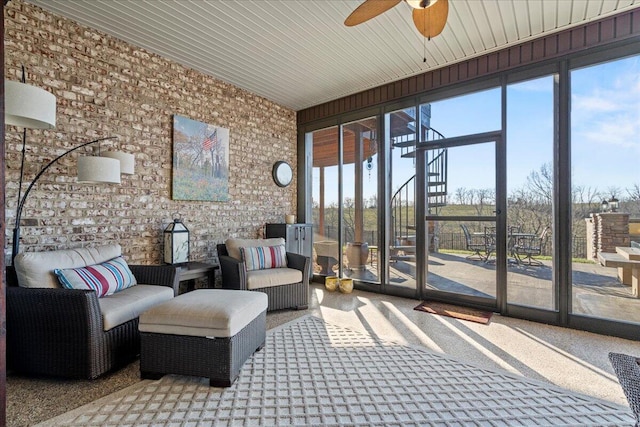 sunroom with ceiling fan and a healthy amount of sunlight