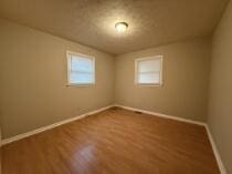 empty room featuring hardwood / wood-style flooring