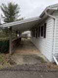 view of side of property with a carport